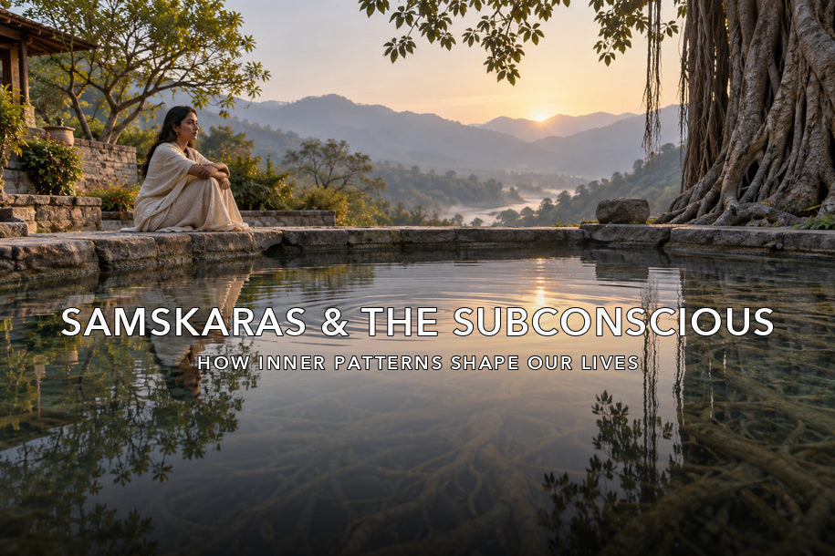 Woman reflecting beside a lotus pond for a guide to samskaras and the subconscious mind
