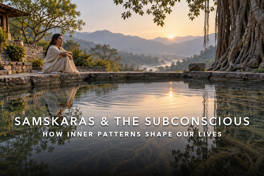 Woman reflecting beside a lotus pond for a guide to samskaras and the subconscious mind