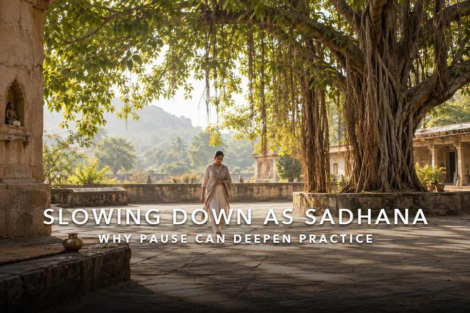 Woman walking slowly beneath a banyan tree for sadhana