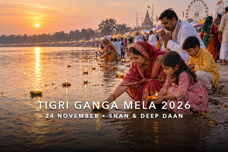 Tigri Ganga Mela 2026 family performing deep daan beside the Ganga