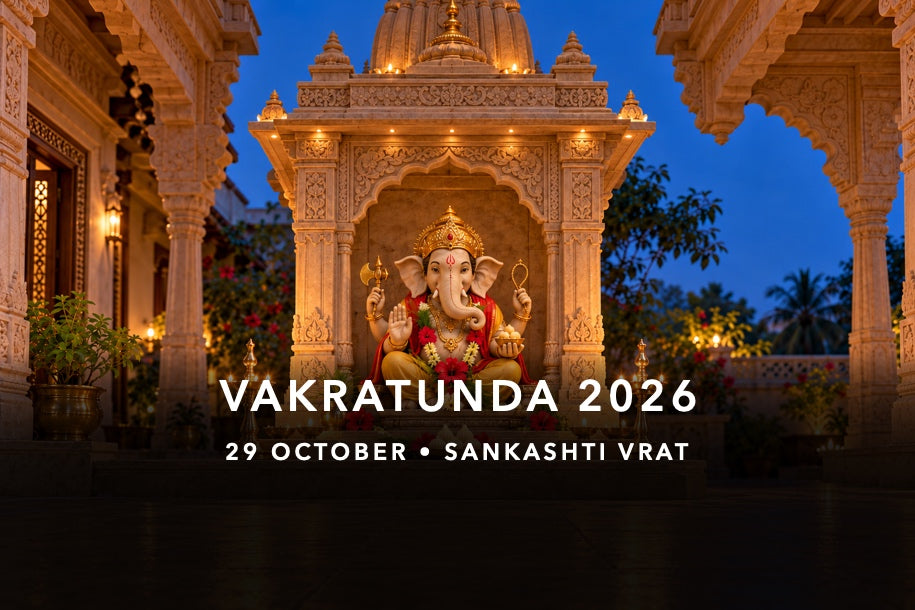 Four-armed Ganesha murti with durva, red flowers and modak in an evening shrine for Vakratunda Sankashti on 29 October 2026