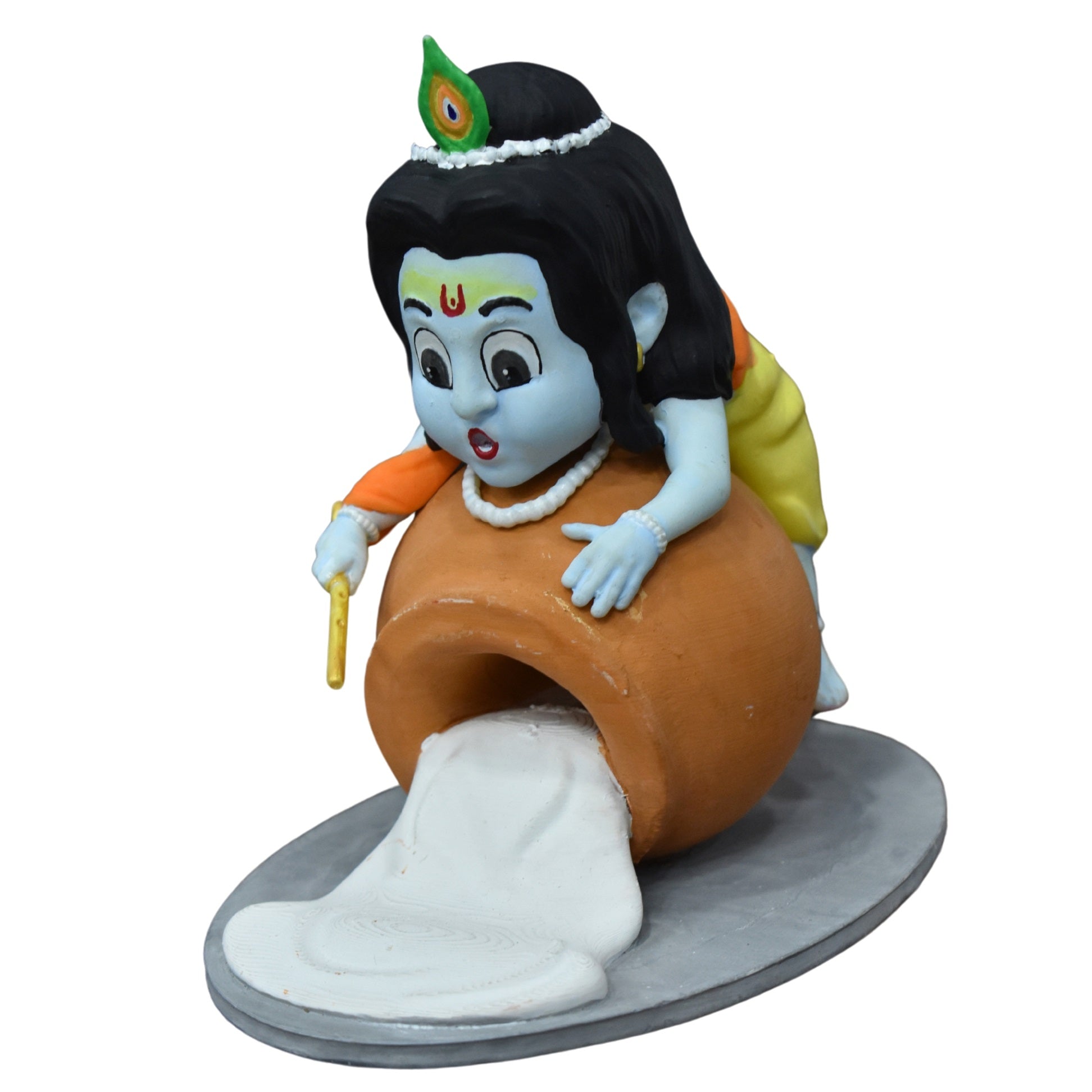 Laddu Gopal idol beside a butter pot