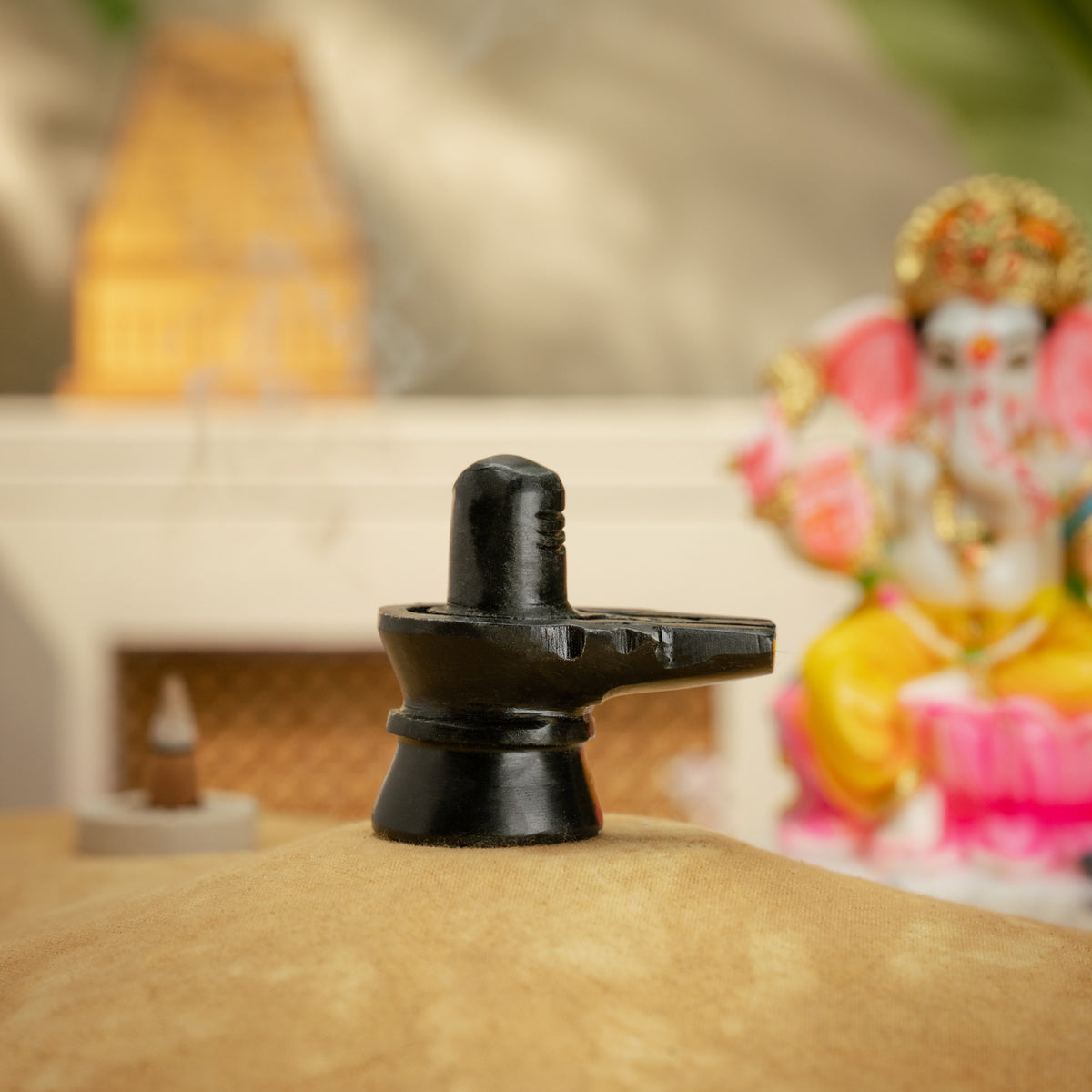 2.5 inch black stone Shivling shown from the side