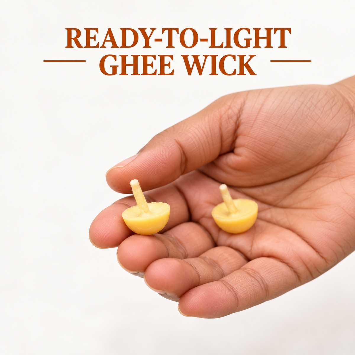Ready-to-light cow ghee wick shown in hand for size reference