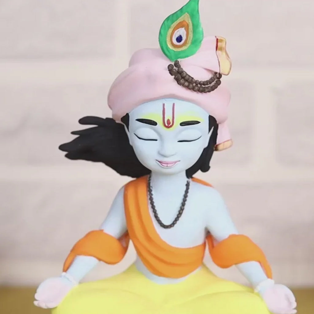 Meditating Krishna idol shown in a peaceful setting