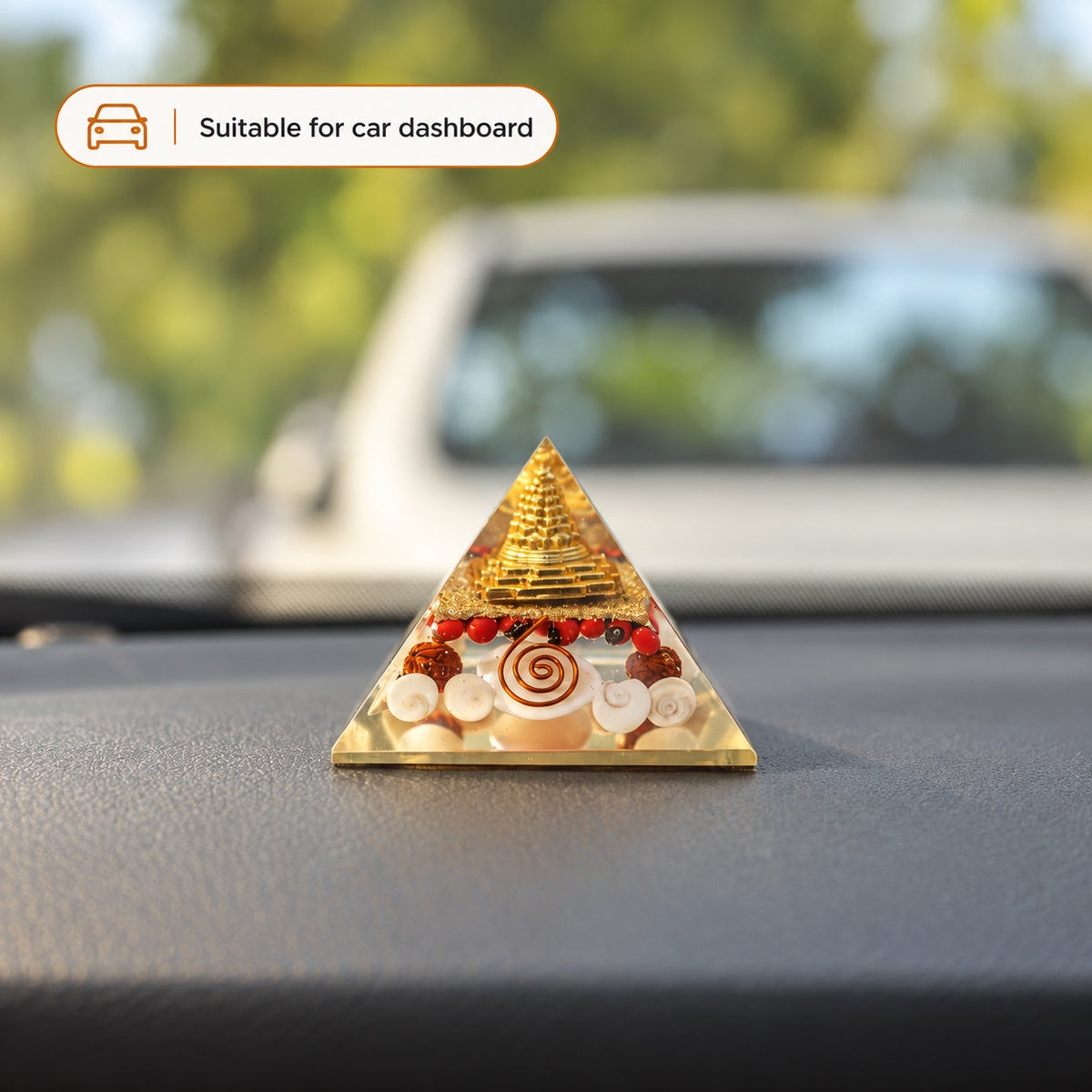Maha Lakshmi pyramid yantra displayed on a car dashboard