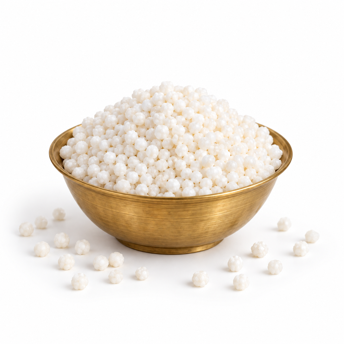 Prasad Dana Elaichi Dana sweet white pearls in a brass bowl